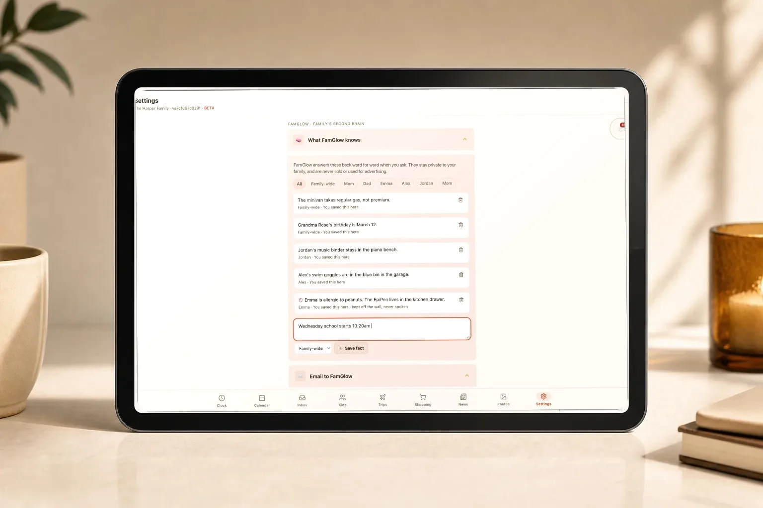 A tablet showing the facts FamGlow remembers for the family, including where Alex&rsquo;s swim goggles are kept and Emma&rsquo;s peanut allergy, with a new fact being typed in