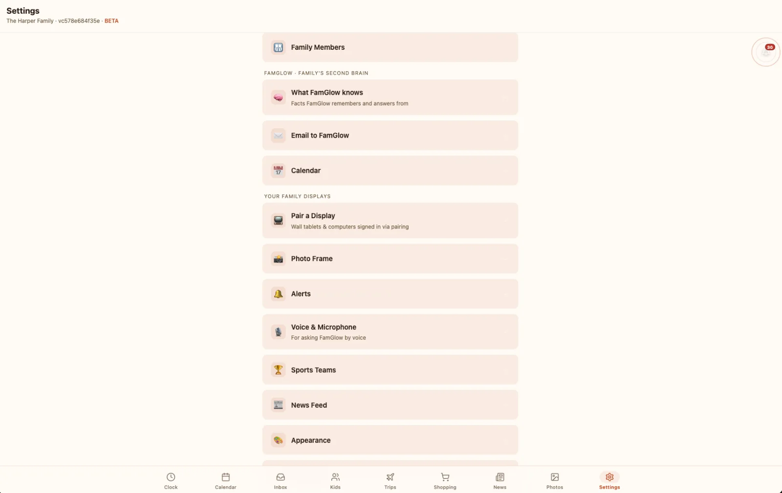 The FamGlow settings screen listing family members, what FamGlow remembers, calendars, paired displays, photo frame, alerts, voice, sports and news